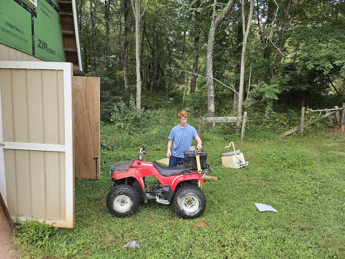 Me adjusting the battery mounting on the nearly complete ATV